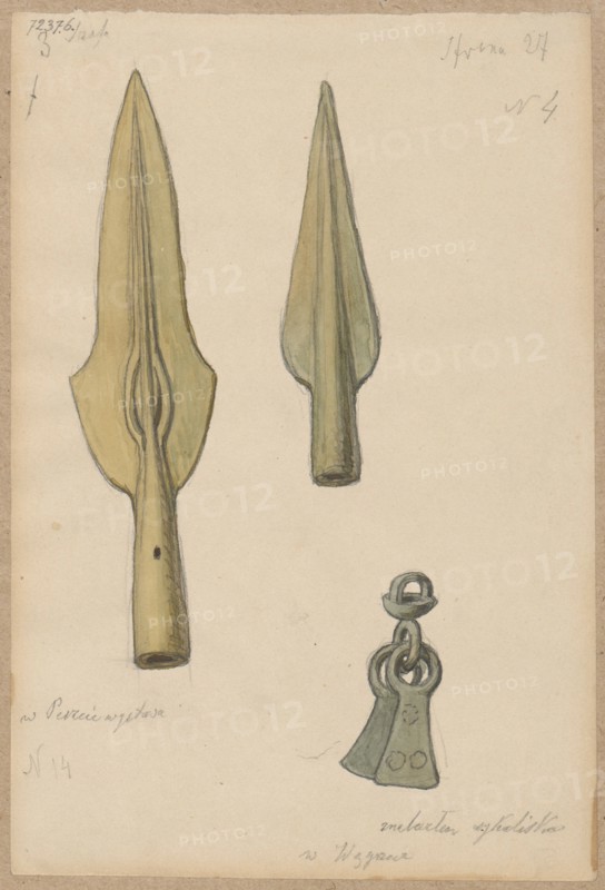 Bronze spearheads; drawing by Aleksander Lesser 1814–1884 as draughtsman; ink or pencil drawing glued at the upper edge to brown cardboard; dated 1856–1884; archaeological excavations; militaria, weapons, melee weapons, spearheads; craft; drawing: 18.9 × 12.8 cm; mounted on cardboard: 34.8 × 25.1 cm; Budapest place of origin?., A hand-drawn illustration on a beige paper background showing a few metal objects rendered in muted green and yellow tones: two elongated spearhead-like shapes with tapered points and hollow sockets, and a small pendant-like piece composed of looped rings and two flared plates with rounded edges. The paper has a slightly darker beige border and small areas of pencil sketch lines and faint smudges.