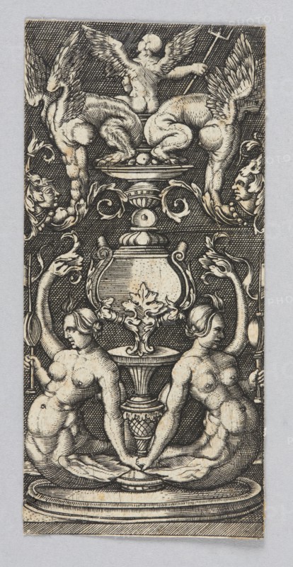 Ornamental panel, Claesz. Allaert graphic artist, mermaids mythology, ornaments, Dzialynska, Izabella née Czartoryska 1830-1899, fantasy creatures, decorations, putti iconography, winged putti iconography, vases, fantasy figures, tridents, 16th century, graphic print, height 8.5 cm, width 4 cm, The image shows a vertical engraved design in black and beige tones on a light gray background, featuring a symmetrical ornamental composition with a central large vase or urn flanked by decorative scrolls and foliage. Above the urn sits a figure with wings and an animal-like lower body, and a cherubic figure with wings is positioned at the top center. On each side of the urn a winged creature or decorative term with a human face is visible. Below the urn two seated nude female figures face outward, each holding a tall torch-like object, their hair styled and their bodies rendered with cross-hatched shading. The lower area includes a circular base or pedestal with layered moldings, and the entir...