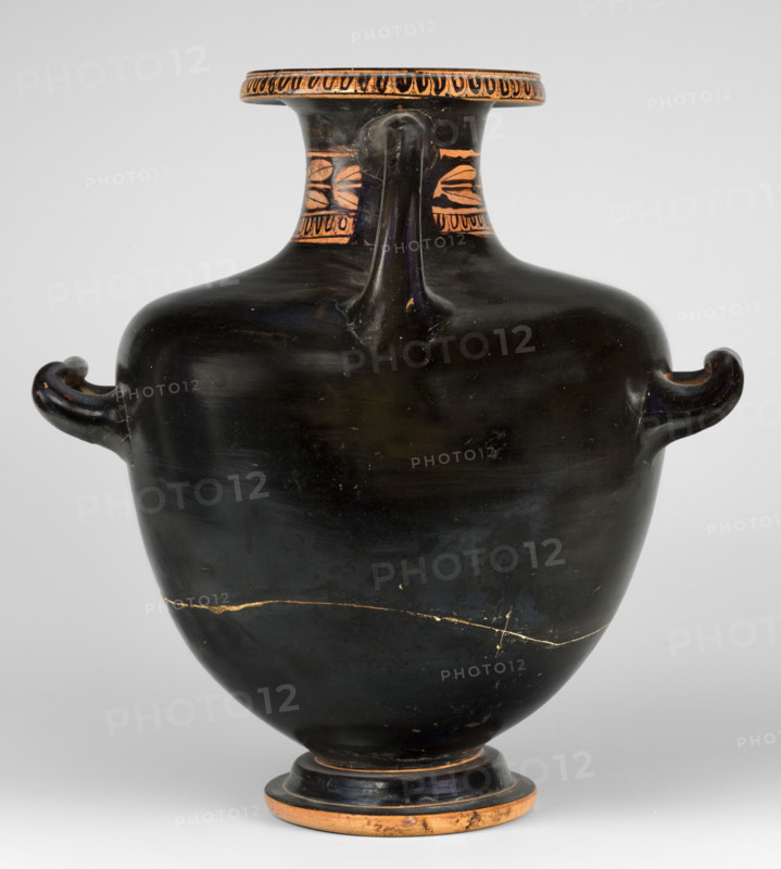 Red-figure hydria by the Amycus Painter, c. 420–400 BC (previously dated 420–410 BC). Greek red-figure hydria on a high profiled foot; the belly widens evenly toward broad, slightly sloping shoulders and a neck terminating in a wide profiled rim. The neck is decorated with an ovoid at the base and a band of leaves above; the ovoid also surrounds the rim edge. Figurative scene on the belly and shoulders above a meander band: a naked youth seated on a rock at center; a man in profile turns back, leaning on a rock with his right hand and resting his left hand on his left knee. The slender, muscular ephebe is flanked by two women in lavish robes — the woman at his left holds a mirror whose reflection the youth gazes into; the woman at his right holds a long branch topped with leaves in her right hand. Lucanian hydria, weight 2.056 kg.