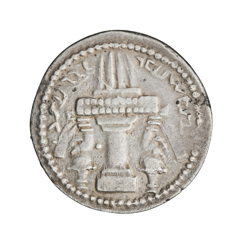 Drachma of Ardashir I (ruler of Persia; 224–242). Iran (Persia). Silver coin, diameter 23.0 mm, weight 4.27 g. Obverse: Bust of the king wearing a crown with korymbos, face turned right. Legend in Middle Persian, transliterated as: 'mazdesn bay Ardaširšahan šah Eran ke cihr az yazdan' — 'follower of (Ahura) Mazda, divine Ardashir, King of Kings of Iran, who descends from the gods.' Reverse: Fire altar. Inscription in Middle Persian. Sassanid art; Sassanid Kingdom; iconography: korymbos (crown), fire altar; busts. Date: 224–241.