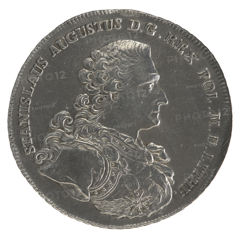 Crown thaler, Sylm, Fryderyk (1765–1767). Obverse: Bust of Stanislaw August Poniatowski in armour and with the Order of the White Eagle, turned right, around the inscription divided at the bottom: STANISLAUS AUGUSTUS DG REX POL. MD. LITHU. — pearl border. Reverse: Under a crown, in a wreath entwined with a sash with the motto PRO FIDE - LEGE, a round five-field coat of arms with the coats of arms of Poland (Orzel), Lithuania (Pogon) and the Poniatowski coat of arms (Ciolek); below on the sash the Order of the White Eagle, flanked by the letters F. - S., around the inscription divided twice: X EX MARCA PURA. - COLONIEN 1766 — pearl border; decorative edge. 1766. Polish–Lithuanian Commonwealth (1569–1795). Coin; diam. 42.4–43.7 mm; weight 28.00 g.
