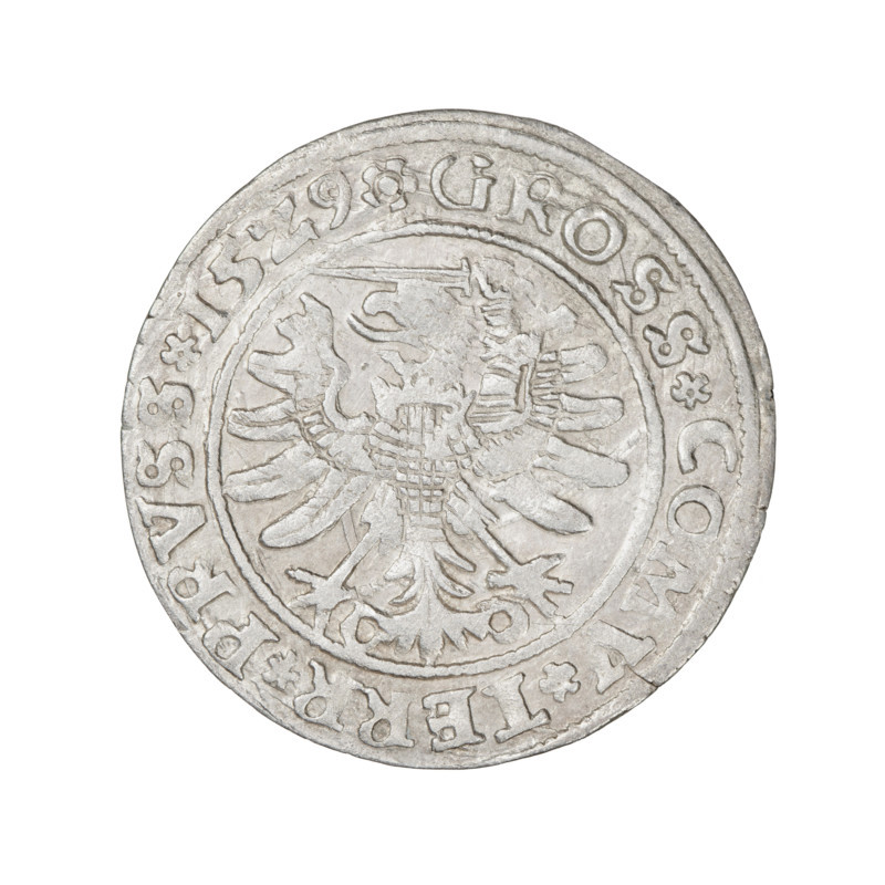 Prussian grosz, Sigismund I the Old (King of Poland; 1506–1548), 1529. Obverse: Crowned male bust in profile turned to the right; rim between pearl borders with inscription '.SIGIS.I.REX.PO.DO.TOCI.PRV'. Reverse: The Eagle of Royal Prussia; rim between pearl borders with inscription '.GROSS.COMV.TERR.PRVSS.15Z9'. Material: coin; motif: eagles, royal bust, emblems; style: Jagiellonian iconography; mint: Torun, Poland.