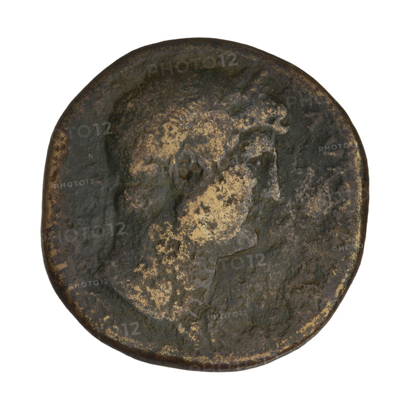 Sestertius of Hadrian (76–138; Roman emperor 117–138). Obverse: head of Hadrian in a laurel wreath right; rim inscription erased. Reverse: Neptune, with a foot on the prow of a ship, stands turned right holding an acrostolium in his left hand and a trident in his right; on both sides SC; rim inscription. Roman Empire, Rome, 2nd century CE. Coin; weight 26.40 g; axis 180 degrees.