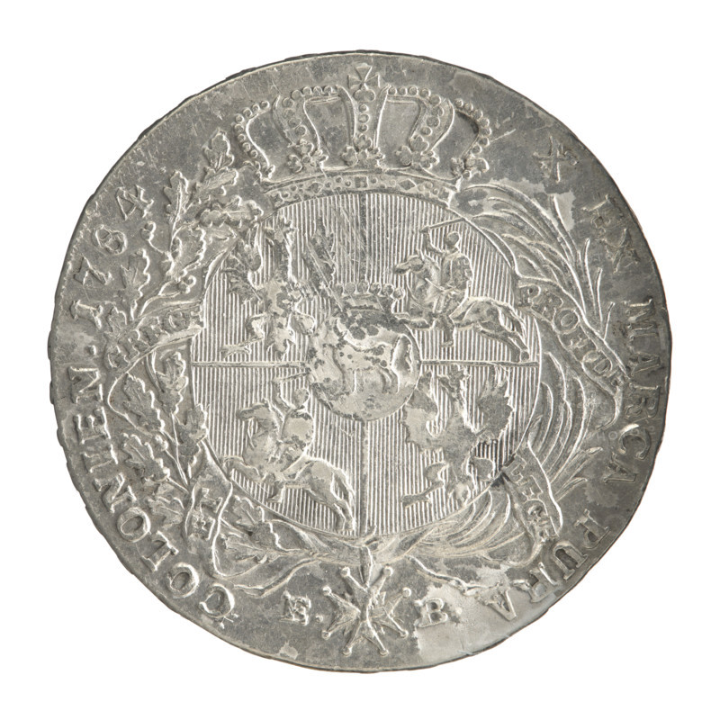 Crown thaler, Stanislaw August Poniatowski (King of Poland; 1764–1795), Brenn, Efraim (fl. 1774–1792). Obverse: Head of Stanislaw August turned right, around the inscription divided at the bottom: STANISLAUS AUGUSTUS DG REX POLON. MDLITUAN. — pearl border. Reverse: Under the crown, in a wreath entwined with a sash with the motto PRO FIDE - LEGE - ET - GREGE, a round five-field coat of arms with the coats of arms of Poland (Orzel), Lithuania (Pogon) and the Poniatowski coat of arms (Ciolek); below on the sash the Order of the White Eagle; on the sides the letters E. - B.; around the inscription divided twice: X EX MARCA PURA - COLONIEN. 1784. — pearl border. Inscription on the edge: FIDEI - PUBLIC, E- PIGNU. 1784. Polish–Lithuanian Commonwealth (1569–1795), Warsaw, Poland. Coin: diameter 40.0–40.5 mm; weight 27.96 g.