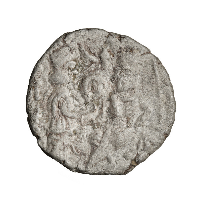 Tetradrachm of Vologases V (191–208). Obverse: bust of Vologases V wearing a tiara, facing left. Reverse: Vologases V enthroned, facing left; opposite him Tyche wearing a high crown (or kalathos) offering a wreath to the ruler. Parthian Kingdom, Seleucia on the Tigris, Iran. Coin; diameter 23.0–24.5 mm, weight 12.85 g. Wreaths, bows (armed), heads, diadems.