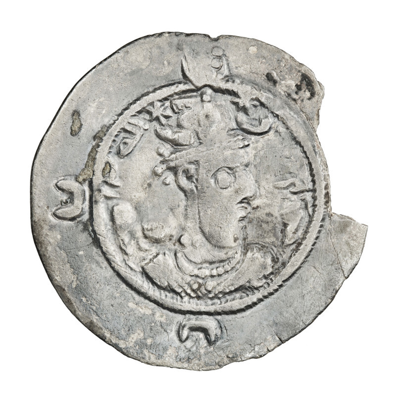 drachma, Khosroes II Anoshirvan (ruler of Persia; 531–579). Obverse: bust of Khosroes I facing right; crown with a diadem, to the right a crescent with a star, to the left a star; short curly beard, hair tied back in a lock; beads on the neck (central one three triangular beads) and a second long chain around the neck; earring of three triangular beads; outside the rim three crescents; on the crown an incomprehensible sign like a flag waving to the left; above the crown outside the rim a sign like a crescent with a globe; Pahlavi inscription. Reverse: burning altar; left of altar the ruler/Arsaces standing facing forward with a sword in his hand; right of altar a priest standing facing forward holding a sword; star at top left and crescent at top right; signs/monograms on both sides; pearl rim; Pahlavi inscription. Date: 537–579. Persia. Coin; weight 3.42 g.