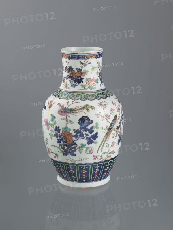 Vase, Chinese, Qing dynasty (1644–1911), 19th century; decorative vessel depicting peonies, phoenixes, butterflies, lotuses, plum trees, cranes, chrysanthemums, birds, and meander ornament; height 39.5 cm, diameter 18.5 cm.