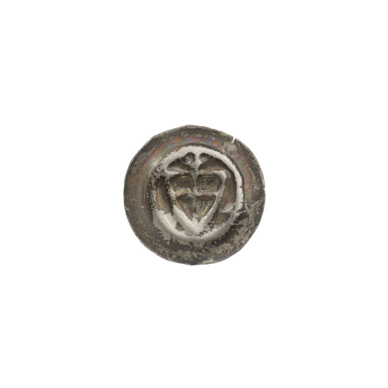 Denarius - bracteate, one-sided coin featuring a triangular shield with a cross whose arms reach the edge; above it, a trefoil; additional shields. Iconography: shield with a cross, trefoil, triangular shield. Issued by the Teutonic Knights (Order), ca. 1307/1308–ca. 1317/1318. Diameter 14.1 mm, weight 0.25 g.