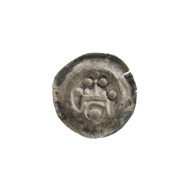Denarius (bracteate). One-sided coin depicting a gate topped with a cross whose arms end in spheres; one sphere at each corner of the gate; a smaller sphere between the cross and the corner spheres. Under the arched vault of the gate, a sphere. Ca. 1257/1258–ca. 1267/1268. State of the Teutonic Order (1226–1525). Diameter 17.5 mm; weight 0.21 g.