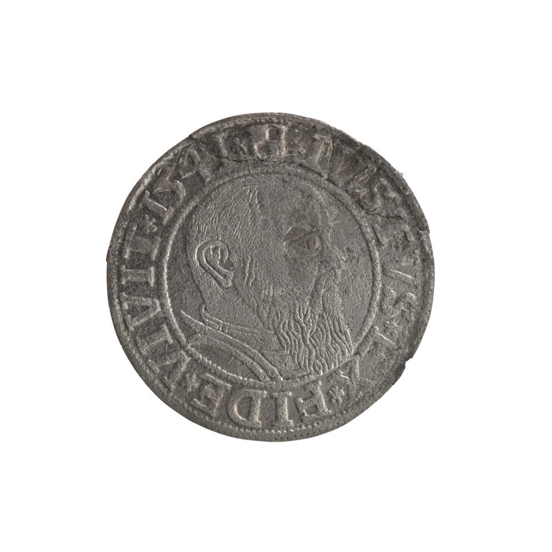 Schilling, Maciej; publisher Decjusz, Jost Ludwik (fl. 1528–1535). Poor preservation. Albrecht Hohenzollern (Prince of Prussia; 1490–1568) — iconography: eagles, trefoils, Hohenzollern coat of arms, male busts in armor. Lebki Wielkie hoard (numismatic find). Obverse: Prussian eagle with crowned letter S on its chest; on rim between pearl borders an inscription beginning with a trefoil ALBER*D*G*MAR*BRAN*DVX*PRVSS. Reverse: male bust in armor, profile to right, short hair, long beard with sideburns; in rim between pearly borders an inscription beginning with Hohenzollern coat of arms * IVSTVS * EX * FIDE * VIVIT * I54I *. Date: 1541. Duchy of Prussia (1525–1701), Königsberg. Coin: diameter 23.7 mm, weight 1.24 g, axis 0°.