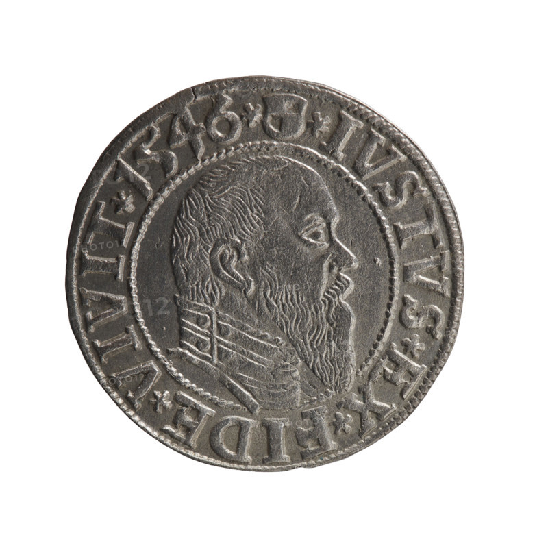 Albrecht Hohenzollern (Prince of Prussia; 1490–1568) — obverse: Prussian eagle with on its chest a crowned letter S; in the rim, between pearl-shaped borders, an inscription beginning with a trefoil ALBER*D*G*MAR*BRAN*DVX*PRVSS. Reverse: male bust in armour in profile turned right; short hair, long pointed beard with sideburns, dividing the inner border; in the rim, between pearl-shaped borders, an inscription beginning with the Hohenzollern shield *IVSTVS*EX*FIDE*VIVIT*I546*. 1546; Ducal Prussia (1525–1701), Königsberg; coin, diameter 23.5 mm, weight 2.13 g, axis 140°.