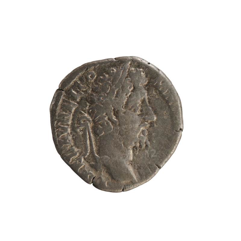 Denarius, Commodus (161–192; Roman emperor 177–192). Obverse: legend L AEL AVREL CO MM; emperor's head right, laurel wreath; pearled border. Reverse: legend M TR P XVII IMP VII; Fortuna Felix standing left with one foot on the prow of a ship, holding a caduceus in her right hand and a cornucopia in her left; star in left field; pearled border. Roman Empire (27 BC–476), Rome; coin; weight 2.83 g; axis 180°.