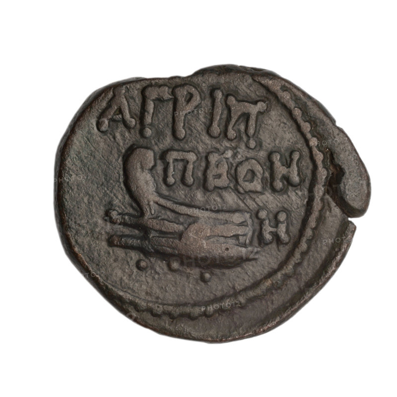 Bronze coin, end 1st century BC, Cimmerian Bosporus, Phanagoria; obverse: head of a woman in a diadem and veil (possibly Aphrodite Urania?) facing right, pearl-like rim; reverse: prora (ship prow) facing left, inscription above in two rows, three dots below, letter H on the right, pearl-like rim; bust of Aphrodite (Aphrodite Urania) and head of Aphrodite motifs; iconography includes head of a woman, head of a woman in a diadem and veil, ships/vessels; weight 6.13 g; dimensions 19.5 mm and 22.2 mm.