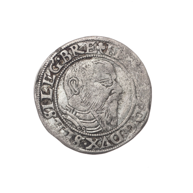Male bust in armour turned right with a beard and sideburns; rim between pearly borders with inscription beginning with a trefoil F .G.DVX.SLESI.LEG.BRE; reverse Silesian eagle; rim inscription VERB., MANET.IN.ETERN. I545. 1545. Maker: Grosz, Stoltz, Michael (fl. ca. 1540–1555). Subject: Frederick II (Duke of Brzeg-Legnica; 1480–1547). Iconography: eagles, Silesian eagle, Piasts (family), portraits of rulers, portraits of the ruler in armor, busts of the ruler, busts of the ruler to the right. Medium: coin. Diameter 23.0 mm; weight 1.77 g; axis 180 degrees. Silesia, Duchy of Brzeg-Legnica-Wolów, Legnica.