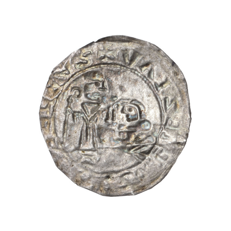 Bracteate, Boleslaw III Wrymouth (Prince of Poland; 1086–1138). Romanesque, Middle Ages, dated 1135–1138. Obverse: In a pearl border, on the left side, facing right, a kneeling prince shown in profile with hands outstretched toward a standing bishop. St. Adalbert, dressed in liturgical vestments, holds a crosier in his left hand and rests his right hand on the prince's head. Inscription around the rim: +SALRBLEZLAV. Motifs: bishop, bishops, crosier, kneeling prince, gesture of care, liturgical vestment. Coin (bracteate), Poland (Kraków/Gniezno). Diameter ca. 24.8–25.8 mm; weight 0.27 g.