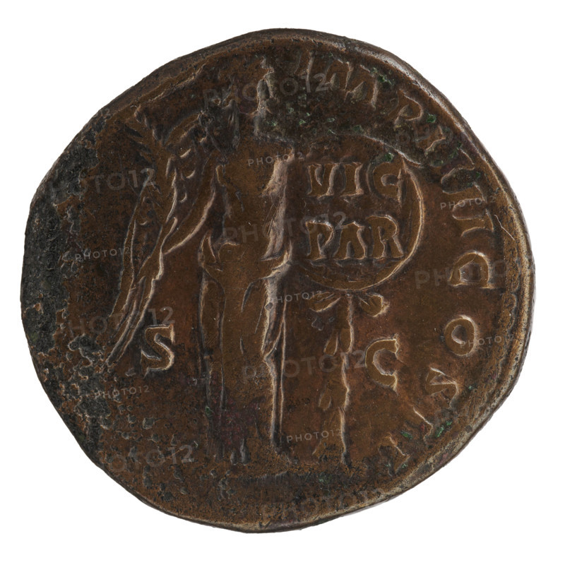 Sestertius of Lucius Verus (130–169; Roman emperor 161–169). Obverse: Head of Lucius Verus in a laurel wreath facing right, legend 'L VERVS AVG - ARM PARTH MAX'. Reverse: Victoria stands right, holds a palm branch in her right hand, supports her left on a round shield inscribed 'VIC / PAR', attached to the trunk of a palm tree; legend 'TR POT VI - IMP IIII COS II'. Fields bear 'S - C'. Date: 165–166. Roman Empire (27 BC–476). Coin. Diameter 29.5–31.0 mm; weight 28.40 g.
