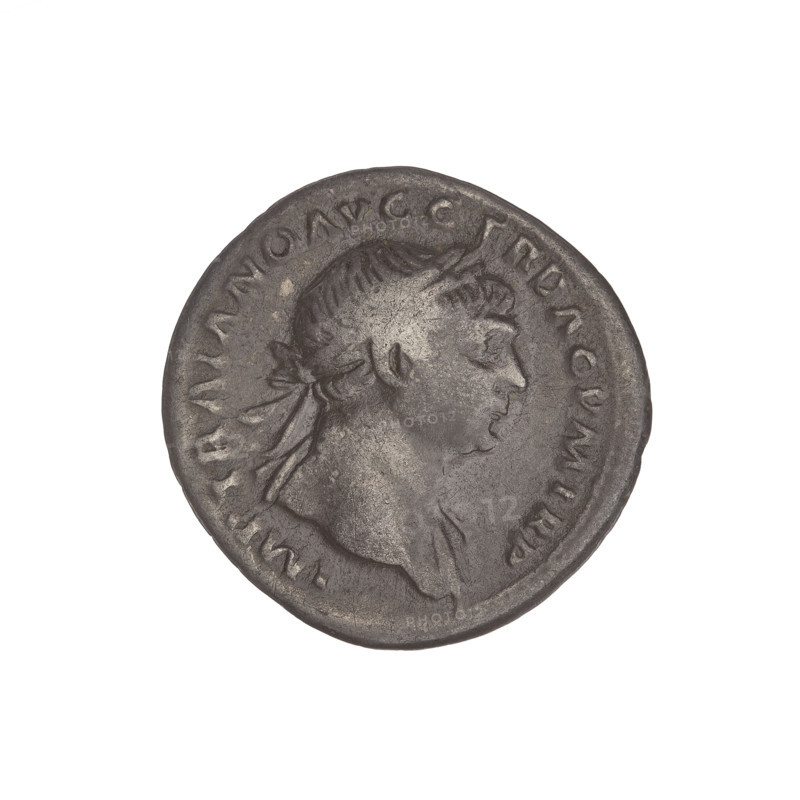 Denarius, Trajan (53–117; Roman emperor 98–117). Obverse: head of Trajan right, laurel-wreathed; rim inscription IMP TRAIANO AVG GER DAC PM TR. Reverse: Roma seated left in military attire, wearing a helmet, holding Victoria in her outstretched right hand and a vertical spear in her left; rim inscription COS VP P SPQR OPTIMO PRINC. Date: 103–111. Roman Empire (27 BC–476). Rome. Coin; weight 3.07 g.