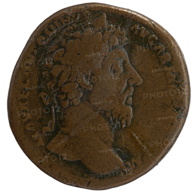 Sestertius, Marcus Aurelius (121–180; Roman emperor 161–180) (issuer). Obverse: Head of Marcus Aurelius with laurel wreath facing right, inscription M AVREL ANTONINVS - AVG ARM, all around. Reverse: Victoria standing right, holding a trophy in both hands; in front of her sits the personification of Armenia, inscription VICT AVG TR P XVIII - IMP II C, all around, in SC fields. Date: 163–164. Roman Empire (27 BC–476). Rome. Coin. Diameter 30.0–31.5 mm; weight 24.30 g; axis 0°.