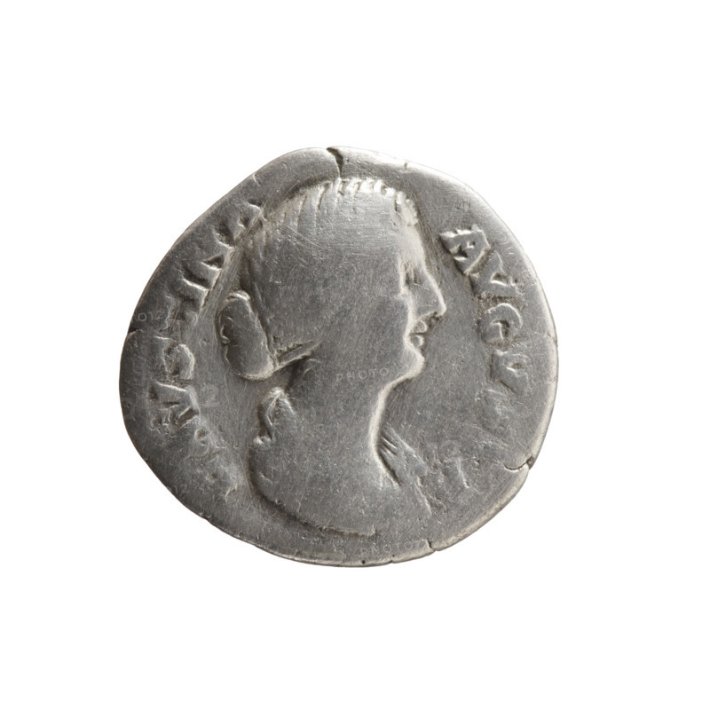Denarius depicting Faustina the Younger (ca. 130–176; Roman empress 161–176) and Marcus Aurelius (121–180; Roman emperor 161–180). Obverse: bust of Faustina II in drapery facing right, inscription FAVSTINA - AVGVSTA. Reverse: Cybele (Magna Mater) in a turret crown seated left, holding a branch in her right hand, resting her left on a drum, with a lion below; inscription MATRI - MAGNAE. Iconography: Cybele, lions, ancient deities, drums, branches; Faustina the Younger — iconography. Date: 161–176 CE. Origin: Roman Empire (27 BC–476), Rome. Object type: coin (denarius). Dimensions: diameter 17.0–18.0 mm, weight 2.78 g, axis 0°.