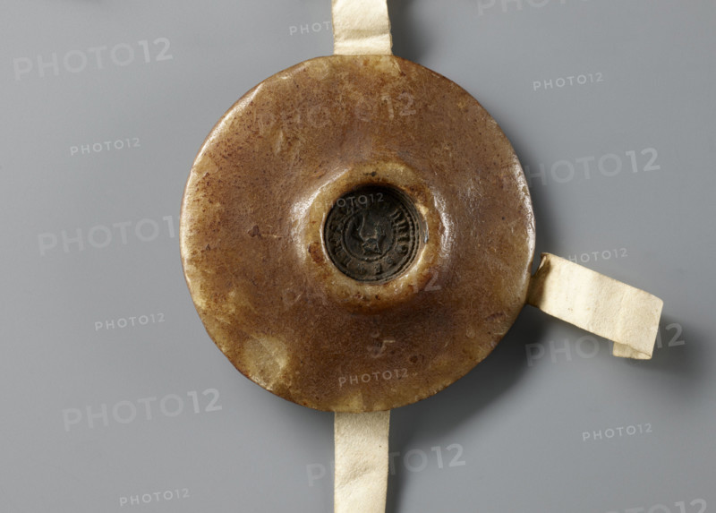 Majestic wax seal attached to a document, Agnieszka (Duchess of Swidnica; 1368–1392). Princely/rulers' seal showing the duchess standing in a long robe and cloak fastened with a button, wearing a headdress. On either side are two shields: Swidnica and Silesia, topped with jeweled helmets in a heraldic bow. Next to the duchess's head a shield with the Austrian coat of arms is woven into the rim inscription. Background is diagonally checkered. Around the rim an inscription in minuscule: 'AGNES . DEI . GRA . DUCISSA . SLE . DNA . DE . FURSTENB'G . IN . SWYDNICZ ET . IN . HYAVOR.' Dated 1389. Duchy of Swidnica. Seal diameter 90 mm; document dimensions 193 mm and 260 + 52 mm (backing during exhibition approx. 45.0 × 31.5 × 3.0 cm).