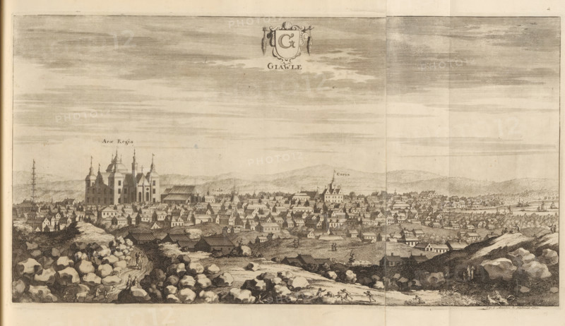 View of the city of Gävle, Giawle, Suecia Antiqua et Hodierna, print, album page, printmaker: Johannes Jacobsz van den Aveele, Stockholm, supervision: Erik Jönssen Dahlberg, 1700, paper, etching, etching in two parts, folded, height 222 mm x width 416 mm, city-view in general, 'veduta', Gävle, A wide monochrome engraving shows a cityscape seen from a rocky foreground with scattered boulders and small paths where tiny figures walk and ride; the middle ground is filled with densely packed buildings of varying rooflines, towers, and steeples, including a prominent large multi-towered cathedral-like structure and several larger roofed halls, with smaller houses stretching toward the shoreline at the right where ships and boats are visible on the water; the distant background contains low rolling hills beneath a sky rendered with horizontal hatch shading, and ornamental cartouche artwork appears near the top center.