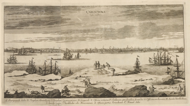 Carlscrona versus meridiem, View of the city of Karlskrona from the south, Suecia Antiqua et Hodierna, print, album page, printmaker: Johannes Jacobsz van den Aveele, Stockholm, supervision: Erik Jönssen Dahlberg, 1709, paper, etching, etching in two parts, folded, height 229 mm x width 415 mm, city-view in general, 'veduta', Karlskrona, A wide seascape engraving showing a shoreline foreground with rocky outcrops and sparse vegetation, figures walking and standing on sandy rises, and a person leading an animal. In the middle distance several sailing ships and smaller boats float on calm water, some with furled sails and visible rigging and flags. The far shore features a low townscape with clustered buildings, windmills, and a continuous line of structures along the horizon. Above, a broad sky is rendered with horizontal shading and scattered cloud forms. The image is monochrome with detailed line work throughout.