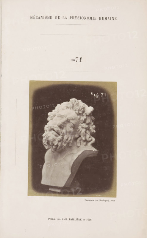 Image of 'Laocoon de Rome', photograph, page, Unnumbered page with photo 71 from Mécanisme de la physionomie humaine ou analyze électro-physiologique de l'expression des passions (Atlas)., photographer: Guillaume Benjamin Amand Duchenne, France, publisher: JB Baillière et Fils, Paris, c. 1860 - in or before 1862, Guillaume Benjamin Amand Duchenne, JB Baillière et Fils, photographer, publisher, paper, albumen print, albumendruk, height 119 mm x width 91 mm, piece of sculpture, reproduction of a piece of sculpture, experiment, test, science and technology, face, morphology of facial expression, physiology and anatomy, physiognomy, nervous system, neurology, A photograph of a sculpted bust mounted on a rectangular base, showing a head tilted back with closed eyes and an open mouth, detailed curly hair and a full beard with textured curls, the bust captured against a dark vignette background and surrounded by a light border, set on a vertically oriented page with ample blank margins.