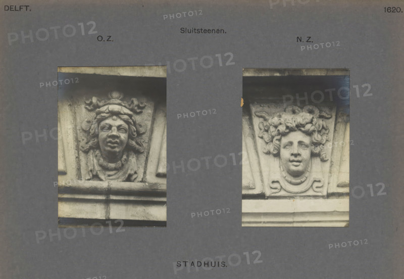 Town Hall. Keystones, Two keystones of the town hall in Delft, decorated with heads, photograph, inscription: 'Delft. OZNZ 1620.', inscription: 'The right of reproduction of these photos is reserved by the Publisher.', number: '55', Delft, c. 1900 - c. 1904, photographer, paper, pasteboard, gelatin silver print, height 168 mm x width 224 mm, townhall, keystone, architecture, Stadhuis (Delft), A rectangular gray background with two vertical photographic panels showing carved stone faces set into architectural ornamentation; the left panel contains a darker-toned carving of a face with pronounced lips, a rounded forehead ornament, wavy hair framing the face, and a draped collar below, set within a textured stone surround and a horizontal molding beneath; the right panel shows a lighter-toned carving of a face with fuller cheeks, curly hair forming a rounded mass around the head, a decorative collar element below, and flanking triangular stone panels, with both panels bordered by thin dar...