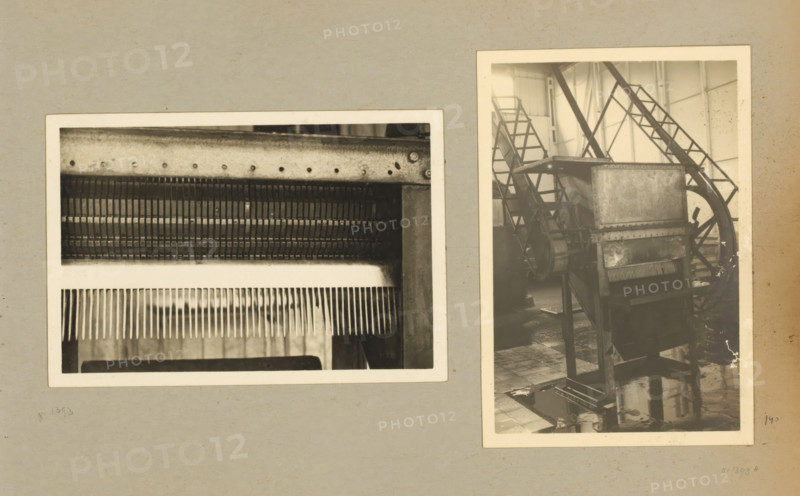 Machine, album page, photograph, Album page with two photos of a machine. Part of a photo album with photos of machines and constructions of the NV Machinefabriek Braat in Surabaya, Sukabumi, and Tegal from the period 1931-1937., Java, 1931 - 1937, photographer, paper, pasteboard, gelatin silver print, developed gelatin silver print, height 106 mm x width 156 mm, height 250 mm x width 320 mm, Person, NV Machinefabriek Braat, machines, parts of machines, tools and appliances, economic history, overseas history, company history, Period, Two black and white photographs are mounted on a gray background. The left photograph shows a close-up of a metal component with rows of thin vertical teeth or fins and a perforated metal strip along the top edge. The right photograph depicts an industrial scene with a tall metal machine featuring a rectangular upper box, a lower chute with visible comb-like teeth, supporting legs, and a large spoked wheel and ladder-like framework behind it; the floor ar...