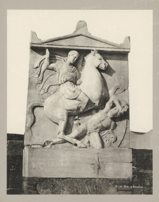 01 Stele of Dexileos, Stela of Dexileos, photograph, number: '32.', Athens, c. 1895 - c. 1915, photographer, Athene, Periféreia Protevoúsis, pasteboard, paper, collotype, photoprint, height 273 mm x width 215 mm, height 328 mm x width 239 mm, A rectangular stone relief framed by a triangular pediment shows a scene with a mounted figure and a fallen male figure; the mounted figure wears draped clothing and a cloak flowing behind, sits astride a rearing horse with a detailed mane and raised front leg, and holds a small object in one hand while the other arm is raised; the fallen male figure is muscular, reclined against the base with one arm raised to shield his head and his body twisted beneath the horse; carved decorative lines and contours define muscles, drapery, and the horse’s tail, and the relief sits on a stone plinth with a cracked surface and a darker textured base beneath.