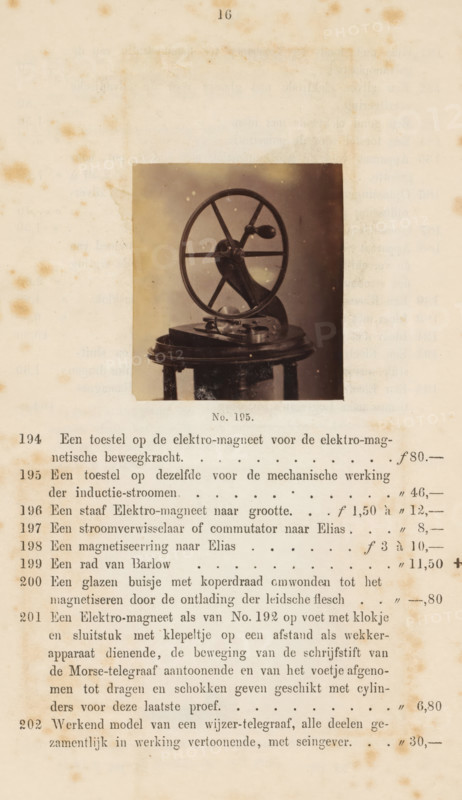 Device on an electromagnet for the mechanical operation of induction currents, photograph, page, number: 'No. 195.', photographer: Fredrich Wilhelm Funckler, Netherlands, c. 1857 - in or before 1867, paper, albumen print, height 59 mm x width 52 mm, Photo on page 16., physics (tools, instruments, laboratory equipment, scientific research), A sepia-toned photograph of a mechanical device mounted on a round wooden table is centered on an aged, stained page; the device features a large circular wheel with spokes attached to a central hub and a lever-like arm with a rounded handle, all rendered in dark metal tones, and the table shows visible legs and surface wear, while the surrounding paper has foxing spots and faint shadowed impressions.