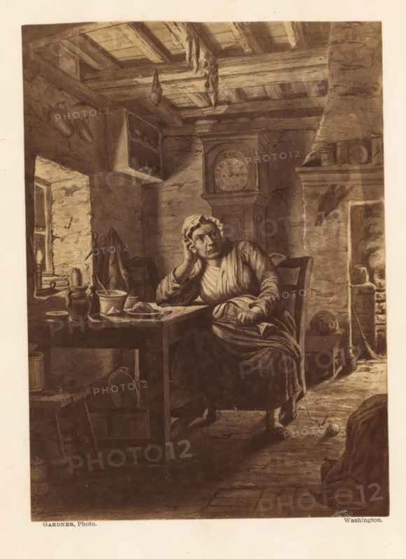 Photo reproduction of a painting, depicting Tam's wife in an interior, photograph, reproduction, page, photographer: Alexander Gardner, Washington (state), after painting by anonymous, c. 1863 - in or before 1868, Alexander Gardner, photographer, after painting by, North America, paper, albumen print, height 172 mm x width 124 mm, adult woman, interior, representation of a building, An interior scene of a rustic room with exposed ceiling beams and a stone fireplace, a seated woman wearing a bonnet and simple dress resting her head on one hand at a wooden table, various pottery and bowls on the table, a shelf and hooks on the walls holding vessels, a tall clock standing against the back wall, hanging items from the ceiling beams, a window with light coming through and rough stone walls, a chair beside the table and a stool near the fireplace, a kettle and other household objects near the hearth, and a worn floor with scattered small items.