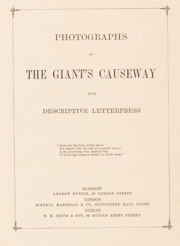 Photographs of the Giant's Causeway with descriptive letterpress, book, annotation: 'SEPT, 1991', annotation: 'George, with Frank's best wishes, August 26th 1869', publisher: Andrew Duthie, Glasgow, publisher: Simpkin, Marshall, and Company, London, publisher: WH Smith & Son, Dublin, c. 1867, Leinster, pasteboard, paper, textile materials, printing, albumen print, color on cut, height 279 mm x width 214 mm x thickness 18 mm, A cream-colored page with a thin decorative border and small floral corner motifs, centered large serif headings and smaller lines of serif text arranged vertically, a short block of centered verse in a smaller font, and additional centered lines of serif text toward the lower half of the page.