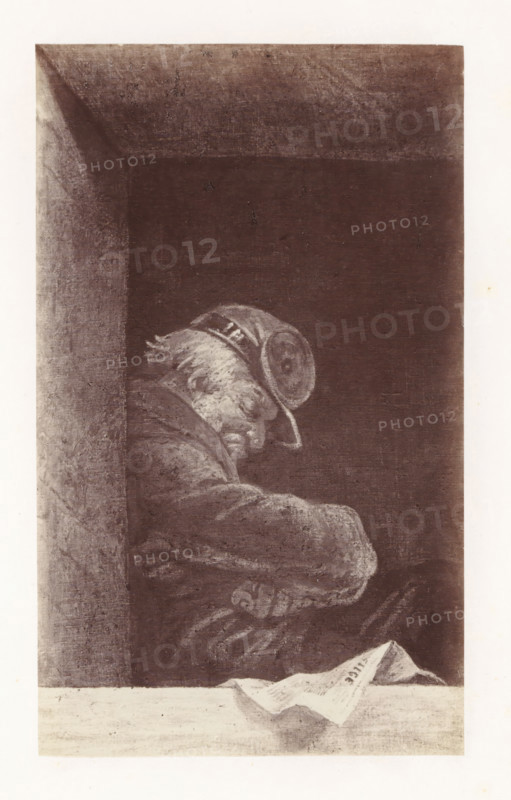 Photo reproduction of The Caretaker by Antoine Wiertz, photograph, reproduction, page, check stamp: 'SOCIÉTÉ ROYALE BELGE DE PHOTOGRAPHIE, 69, RUE KEYENVELD, BRUXELLES', photographer: Edmond Fierlants, after painting by Antoine Joseph Wiertz, c. 1863 - in or before 1868, paper, albumen print, albumendruk, height 169 mm x width 101 mm, adult man, sleeping in chair, A framed rectangular scene with a dark interior and a lighter border showing a seated figure in profile leaning forward. The figure has a pale, textured face with visible hair and wears a rounded hat with decorative banding; the head is tilted downward. The figure is clothed in a heavy, textured garment with folds and visible armrests or crossed arms. A ledge or table in the foreground holds a folded sheet of paper with a folded corner, casting a faint shadow. The left side shows a vertical column or wall with rough texture meeting the dark background. The image is rendered in muted monochrome tones with visible grain and sha...