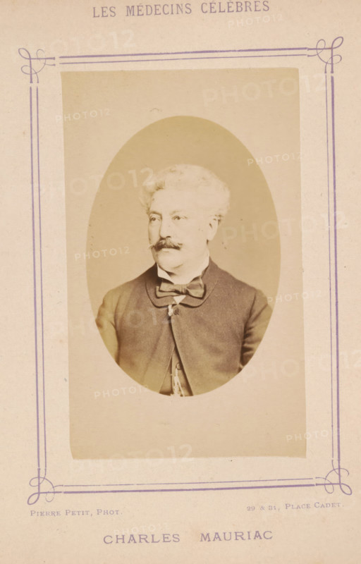 Portrait of Charles Mauriac, Charles Mauriac, photograph, page, inscription: '(Publication de la Revue de literary médicale du, D. Félix. Bremond, 20, Passage Saulnier, Paris. No.', photographer: Pierre Petit, c. 1871 - c. 1879, paper, albumen print, albumendruk, height 89 mm x width 56 mm, Person, historical persons, adult man, An oval sepia portrait of a seated older man with light curly hair and a thick mustache, wearing a dark jacket with a bow tie and a visible chain hanging from his jacket, mounted on a pale rectangular card with decorative purple border lines and ornamental corner flourishes.