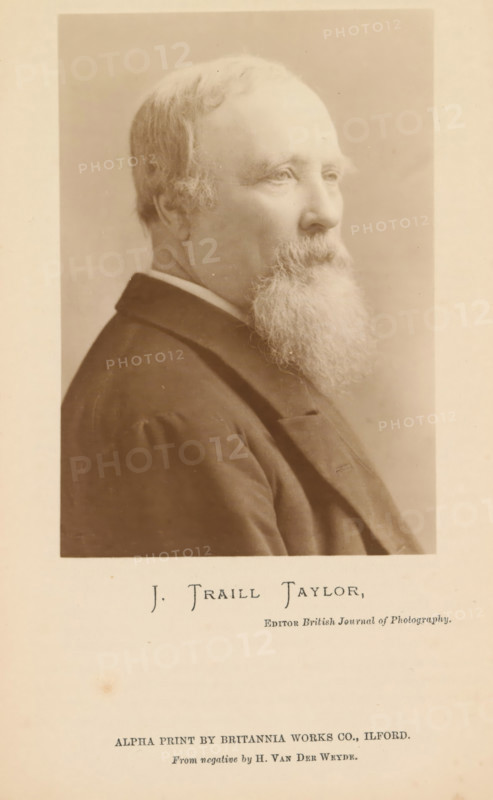 J. Traill Taylor, Portrait of John Traill Taylor, photograph, page, inscription: 'Editor British Journal of Photography, Alpha print by Britannia works co., Ilford', photographer: Henry van der Weyde, c. 1886 - in or before 1891, paper, daylight gelatin silver print, daylight gelatin silver print on Alpha paper, height 120 mm x width 83 mm, Person, John Traill Taylor, historical persons, A sepia-toned portrait of an older man shown in profile facing right, with a receding hairline, short hair at the sides, and a long full beard that extends from his chin downward; he is wearing a dark coat with a visible collar and lapel and a lighter shirt collar underneath, and the portrait is set within a bordered rectangular frame on a lighter background.