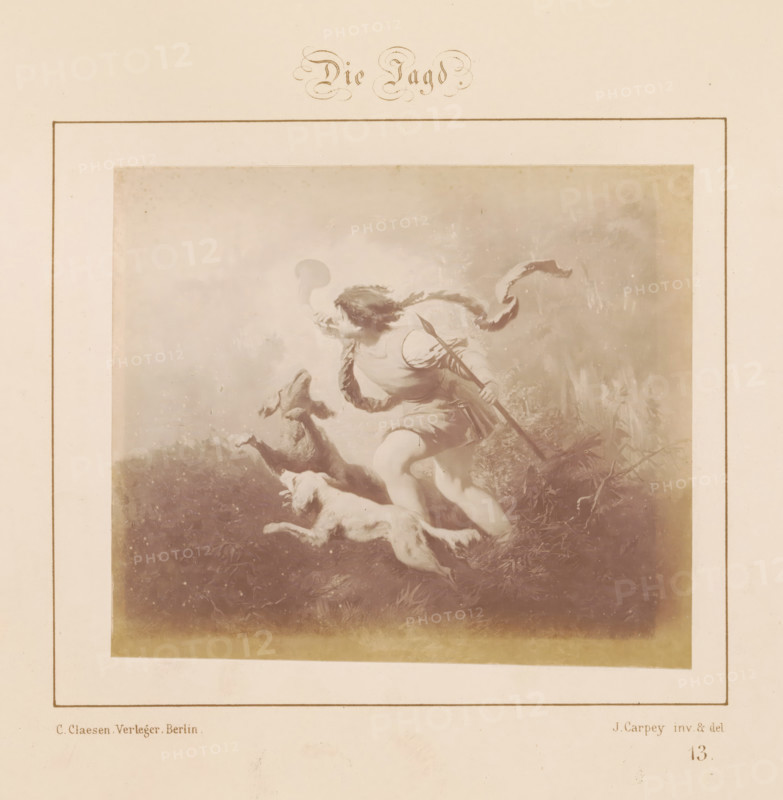 Photographic reproduction of a design of a hunting man with two dogs by J. Carpey, Die Jagd, photograph, reproduction, page, number: '13.', after design by J. Carpey, publisher: Ch. Claesen Éditeur, Berlin, c. 1853 - in or before c. 1858, photographer, paper, albumen print, height 114 mm x width 131 mm, hunting dogs, hunting, chase (sportsman, player, etc. (sports, animals)), A faded rectangular print framed by a double border shows a dynamic scene of a figure in classical-style clothing running with a long staff, a flowing ribbon trailing behind, and two dogs leaping beside the figure, all rendered in soft, muted tones with a textured, painterly background and an aged paper border.