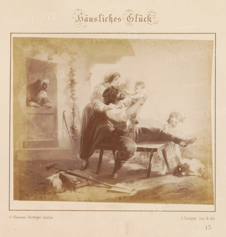 Photographic reproduction of a design of a happy family by J. Carpey, Häusliches Glück, photograph, reproduction, page, number: '15.', after design by J. Carpey, publisher: Ch. Claesen Éditeur, Berlin, c. 1853 - in or before c. 1858, photographer, paper, albumen print, height 121 mm x width 147 mm, family life at home, happy marriage, A faded sepia illustration framed by a thin rectangular border shows a domestic scene with a bearded man seated on a stool holding a baby up toward a woman who leans over him, a little girl seated on a low bench nearby with one leg extended and a small dog lying at her feet, a woman peering from a doorway at the left, climbing plants around the doorway, a wooden bench and scattered tools and clothing on the floor in the foreground, and a light background that fades toward the top and sides.
