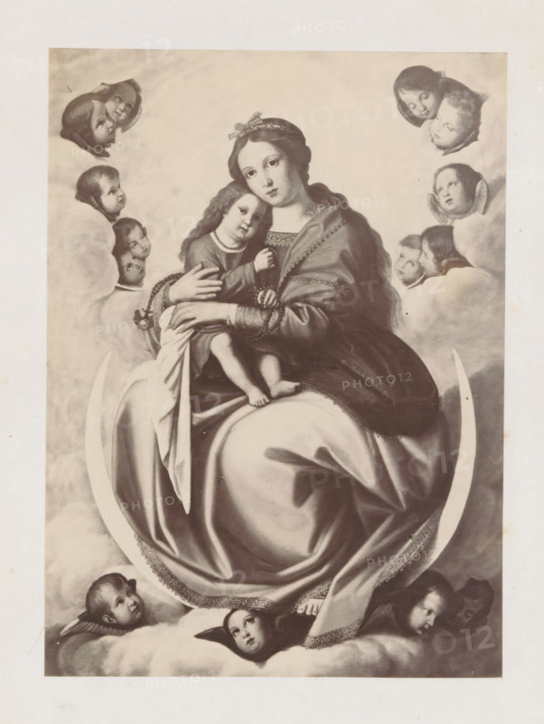 Photo reproduction of an engraving of Mary with Christ as a child by Giovanni Battista Salvi in the Vatican, photograph, reproduction, page, after print by anonymous, after painting by Giovanni Battista Salvi, c. 1863 - in or before c. 1868, photographer, after print by, paper, albumen print, albumendruk, height 168 mm x width 123 mm, Mary sitting or enthroned, the Christ-child in front of her, sitting in her lap (or in front of her bosom), Vatican City, Vatican Museums, A grayscale painting shows a seated woman holding a child on her lap, both wearing flowing garments with decorative trim; the woman has a headband and looks forward while the child leans against her chest. They are surrounded by clouds and multiple cherubic faces emerging from the clouds around them, some with small wings near their heads. A crescent shape is visible beneath the woman's robes, and portions of fabric drape over it. The overall scene fills a rectangular border with a light margin around the image.