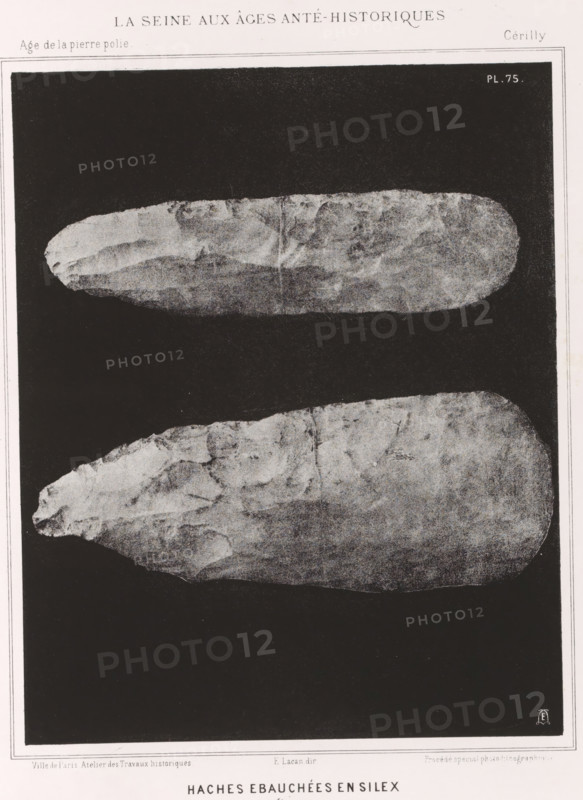 HACHES EBAUCHÉES EN SILEX 1, 1 nature, Flint axes, page, photomechanical print, number: 'Pl. 75', monogram: 'LEL', inscription: 'Ville de Paris. Atelier des Travaux historiques. E. Lacan, dir. Procédé spécial photo-lithographique.', France, cliché maker: Ville de Paris Atelier des Travaux historiques, Paris, publisher: Imprimerie Impériale, supervision: Ernest Lacan, c. 1860 - in or before 1869, photographer, paper, photolithography, height 240 mm x width 190 mm, For location of print in book: see number under 'Inscriptions, Brands'., animals (skeleton of an animal), palaeontology, A vertical grayscale image showing two elongated, roughly oval stone objects placed one above the other against a dark background, each with irregular, textured surfaces and worn edges; a narrow light border surrounds the dark area and a thin margin frames the whole image.