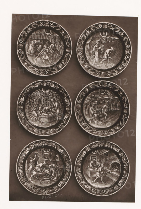 Six enamel signs, set up during the 1873 Exposition Rétrospective in Tours, France, page, photomechanical print, maker: Gabriel Blaise, Tours, 1873, paper, Woodburytype, Woodburytypepie, height 230 mm x width 155 mm, temporary exhibition, 'Salon', dish, plate, saucer, enamelling, applied arts, Period, 1873-05-03 - 1873-05-25, A vertical panel showing six round decorative plates arranged in two columns and three rows against a dark background, each plate featuring an ornate patterned rim and a central engraved scene with human figures and architectural or natural elements; the top left plate shows figures working in a field with tools and bundles, the top right plate depicts two figures near a building and a field with one bending and the other standing with a basket, the middle left plate presents figures around a tub beneath trees, the middle right plate shows two seated figures and one standing figure in an outdoor setting with buildings in the distance, the bottom left plate contain...