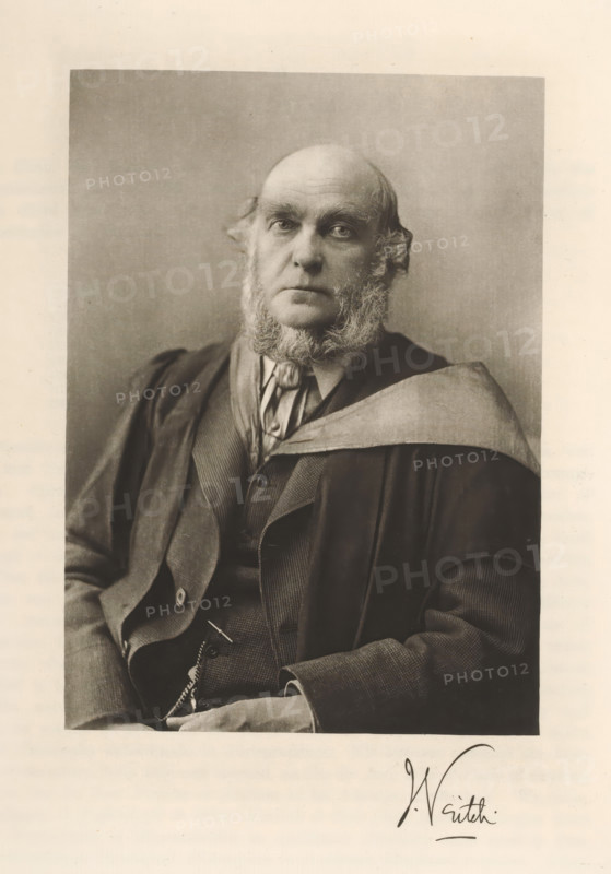 Portrait of John Veitch, Veitch, page, photomechanical print, cliché maker: T. & R. Annan & Sons, Glasgow, c. 1886 - in or before 1891, photographer, paper, photoaquatint, height 189 mm x width 136 mm, Print on second unnumbered page after page 41., Person, John Veitch, historical persons, scholar, philosopher, writer, poet, author, A sepia-toned portrait of an older man shown from the waist up, wearing a dark academic gown draped over a suit and waistcoat, with a light-colored collar or stole across one shoulder; he has a high forehead with thinning hair, bushy sideburns and a short beard framing his jaw, and he gazes directly toward the camera with a neutral expression, one hand resting in his lap and a chain visible near his waist.