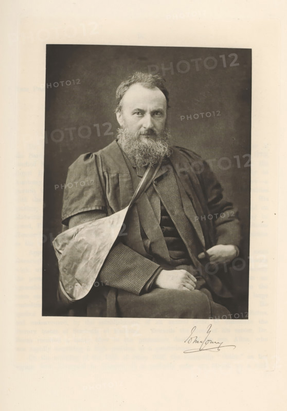 Portrait of John Young, John Young, page, photomechanical print, cliché maker: T. & R. Annan & Sons, Glasgow, c. 1886 - in or before 1891, photographer, paper, photoaquatint, height 192 mm x width 147 mm, Person, historical persons, professor, A sepia-toned portrait of a seated bearded man wearing a dark robe over a patterned suit and vest, with one arm in a light-colored sling and his other hand resting on his lap; he has a full beard and mustache, tousled hair, and a direct gaze, set against a plain dark backdrop and framed by a lighter border.