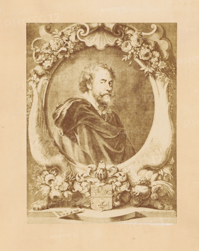 Photographic reproduction of an engraving of a portrait of Peter Paul Rubens by Jean-Marc Nattier, after the painting by Peter Paul Rubens, photograph, reproduction, page, photographer: Dechamps et Cie., after print by Jean-Marc Nattier, after painting by Peter Paul Rubens, c. 1859 - in or before c. 1864, Jean-Marc Nattier, after print by, paper, albumen print, height 199 mm x width 150 mm, Person, historical persons, portrait, self-portrait of painter, A sepia-toned engraved portrait shows a man with curly hair and a beard turned slightly to one side, wearing a draped cloak with visible folds and a decorative collar, positioned inside an ornate oval frame. The oval frame is embellished with floral garlands at the top and sides, a scallop shell motif above the man's head, and scrollwork. Beneath the oval, there is a symmetrical decorative cartouche with acanthus-like scrolls, a small shield, and clusters of fruits and flowers flanking each side. At the lower edge of the image, two paw-...