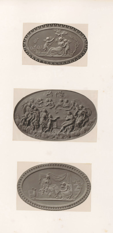 Bas-reliefs of Psyche being bound by putti, a feast of the gods and friendship comforting sorrow, photograph, page, photographer: Joseph Cundall, c. 1868 - in or before 1873, paper, carbon print, height 361 mm x width 270 mm, Friendship, 'Amicitia' (Ripa), sculpture (relief, sculpture), banquets, feasts of the gods (in general), other scenes from the story of Cupid and Psyche (aggressive, unfriendly activities and relationships), A vertical sheet shows three oval relief plaques mounted one above another, each with a decorative border and classical figures in low relief; the top plaque depicts a seated robed woman with two small winged children beside her and a child reaching toward a leafy branch above, set against a plain background with a patterned rim; the middle plaque shows a crowded scene of many draped and partially draped figures in dynamic poses, some seated and some standing, with reclining figures and a sense of layered depth and cloudlike forms at the lower edge; the bottom...