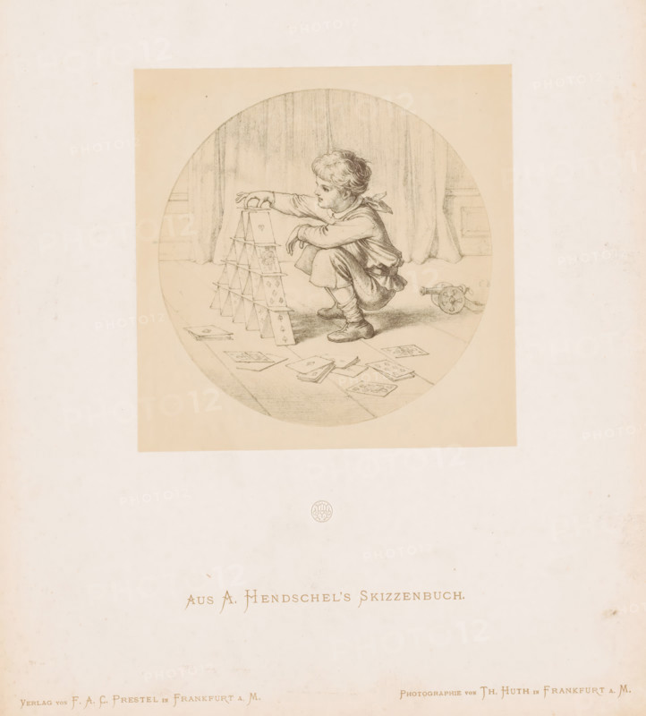 Photo reproduction of a boy building a house of cards by Albert Hendschel, Aus A. Hendschel's Skizzenbuch, photograph, reproduction, This photo is part of a cover with 50 photos on 48 sheets, a list of images and a title page., number: '23', monogram: 'AH', photographer: Theodor Huth, after design by Albert Hendschel, publisher: Ferdinand August Christian Prestel, Frankfurt am Main, c. 1865 - in or before c. 1870, Theodor Huth, Albert Hendschel, Ferdinand August Christian Prestel, photographer, after design by, publisher, Hessen, paper, albumen print, albumendruk, height 132 mm x width 130 mm, boy (child between toddler and youth), playing-cards, A circular pencil drawing shows a young child crouching on a floor while building a tower of playing cards, the child reaching to place a card on top and wearing a tunic with a scarf tied at the neck and ankle-high shoes, with scattered cards lying on the floor nearby and a small wheeled toy behind the child, all set against a backdrop of drap...