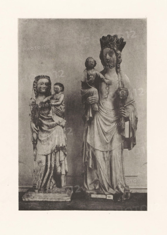 Sculpture of alabaster and a sculpture of marble of Mary with child, displayed at an exhibition of religious objects from the Middle Ages and Renaissance in 1864 in Mechelen, page, photomechanical print, number: '-7', number: '11 - 10', number: '10.11', photographer: Joseph Maes, Mechelen, clichémaker: Simonau & Toovey, 1864 - in or before 1866, paper, photolithography, height 232 mm x width 155 mm, Mary standing (or half-length), the Christ-child sitting on her arm (Christ-child to Mary's left), piece of sculpture, reproduction of a piece of sculpture (stone, arts), Mechelen (lordship), Period, 1864, A grayscale photograph shows two tall carved statues standing on rectangular bases against a plain backdrop. The statue on the left depicts a robed female figure holding a small child on her left arm; the woman's head is covered by a draped headdress and her clothing has visible folds and patterns, while the child is depicted with short curly hair and a wrapped garment. The statue on the ...