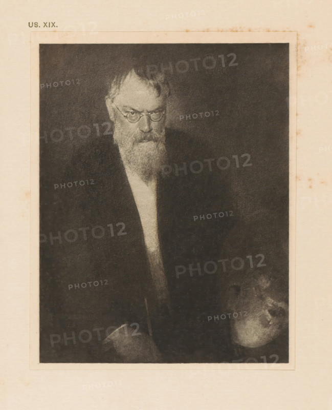 Portrait of Franz von Lenbach, page, photomechanical print, inscription: 'Portrait of Franz von Lenbach by Eduard J. Steichen', inscription: 'US. XIX.', photographer: Edward Steichen, cliché maker: anonymous, c. 1900 - in or before 1905, paper, photoaquatint, height 129 mm x width 101 mm, Person, Franz von Lenbach, historical persons, portrait, self-portrait of artist, A sepia-toned portrait of an older man with round glasses and a long beard, shown from the torso up against a dark background, wearing a dark jacket and a lighter shirt beneath; the image is framed by a lighter paper border with subtle stains and spotting around its edges.