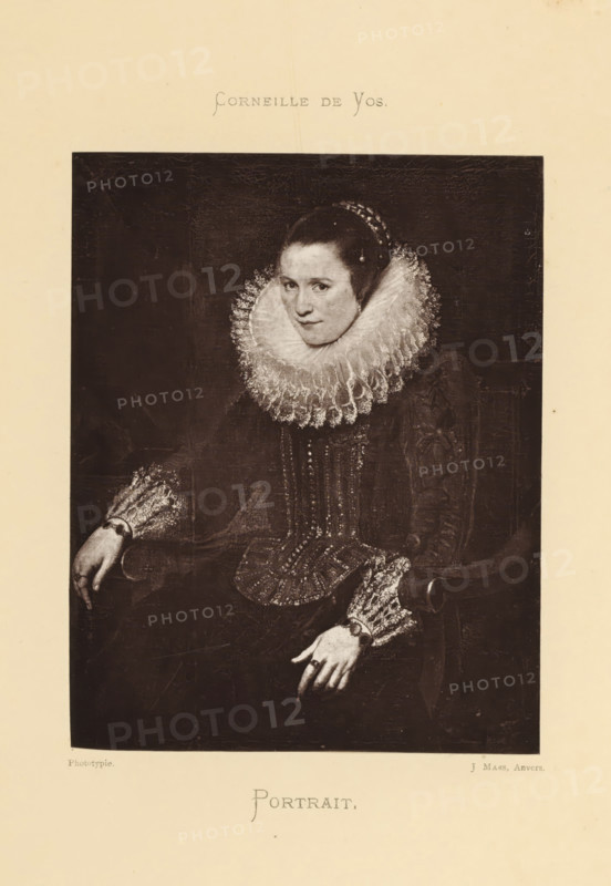 Reproduction of a painted portrait of Anne-Frederick van der Bouchorst by Cornelis de Vos, Portrait, reproduction, page, photomechanical print, photographer: Joseph Maes, Antwerp, after painting by Cornelis de Vos, c. 1873 - in or before 1878, paper, Woodburytype, height 149 mm x width 118 mm, Person, Anne-Frederick van der Bouchorst, historical persons - BB - woman, A seated woman in dark, formal clothing occupies the central framed area, wearing a large, elaborate ruffled collar and matching ruffled cuffs, with her hair pulled back and adorned with a beaded headpiece; her face is turned slightly toward the viewer with a neutral expression, and her hands rest on the arms of a chair, one hand showing a ring. The clothing features decorative vertical elements and textured fabric, and the background inside the frame is dark and plain. The image is printed on a light-colored page with wide margins surrounding the dark inner portrait.