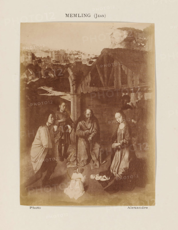 Photo reproduction of The Adoration of the Shepherds by Gerard David, photograph, reproduction, page, inscription: 'Memling (Jean)', photographer: Alexandre, after painting by Gerard David, c. 1878 - in or before 1883, paper, albumen print, height 139 mm x width 103 mm, adoration of the Christ-child by the shepherds, Mary and Joseph present, A sepia-toned image of a religious scene shows a group of robed figures gathered around an infant lying on a cloth on the ground, with another small child and figures kneeling and standing nearby; a woman in a long dress kneels with hands clasped, a bearded man stands with hands together, and other attendants in robes and cloaks form a semicircle; behind them is an arched wooden structure and a distant landscape with clustered buildings, a winding river, and hills under a pale sky.